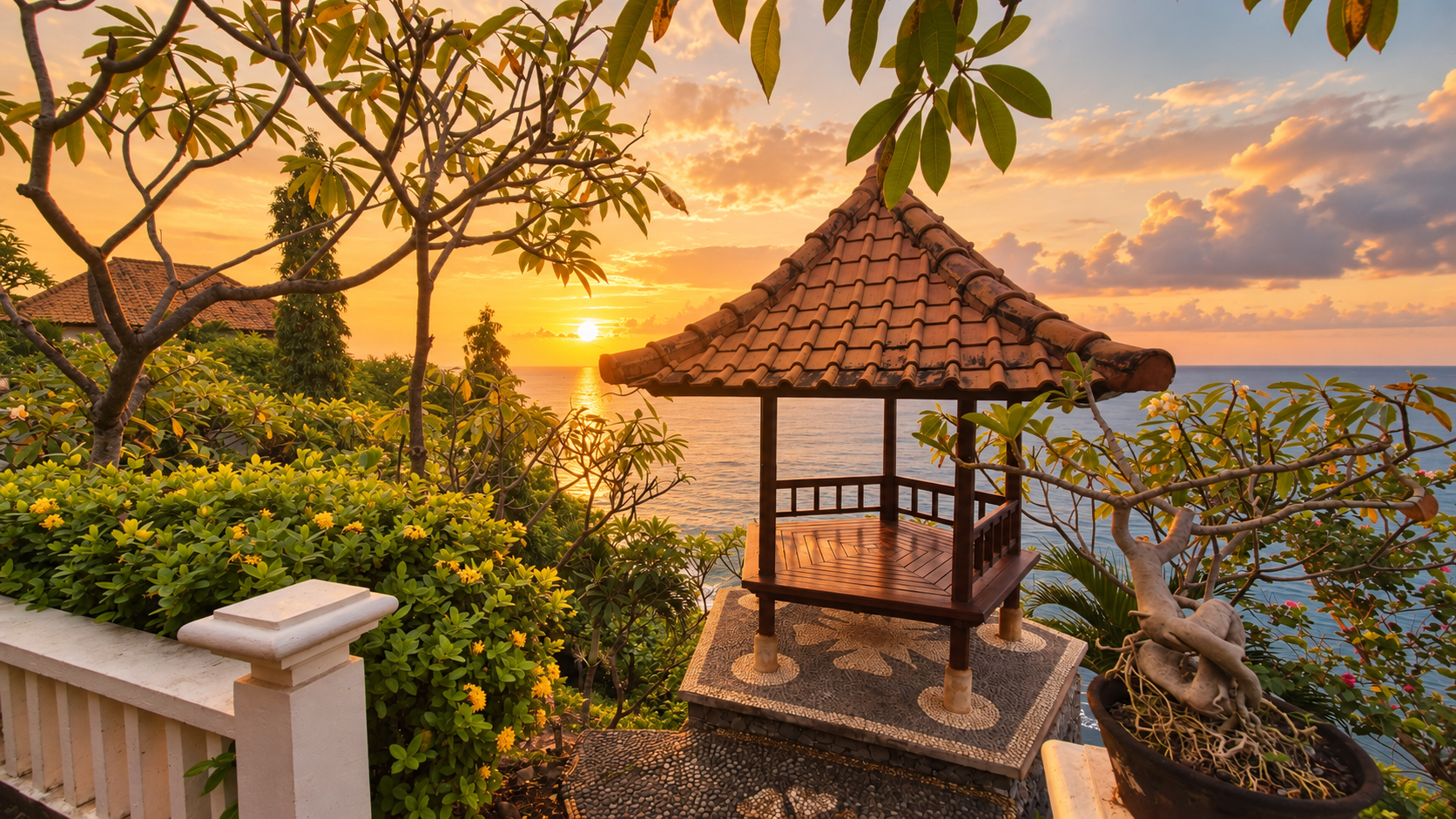 A traditional Balinese pavilion overlooking the ocean at sunset